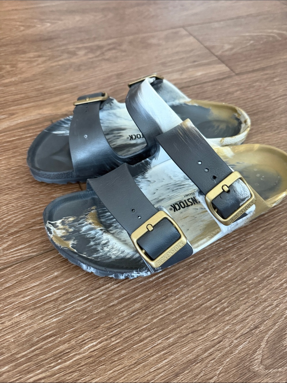 Birkenstock Two-Strap Black and White Marbled Sandals with Gold Buckles